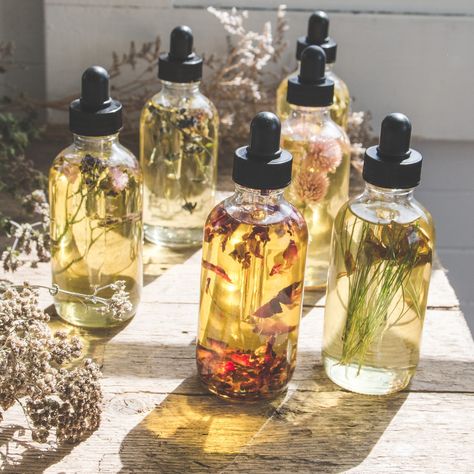 Collection of natural body oils displayed on a vanity table
