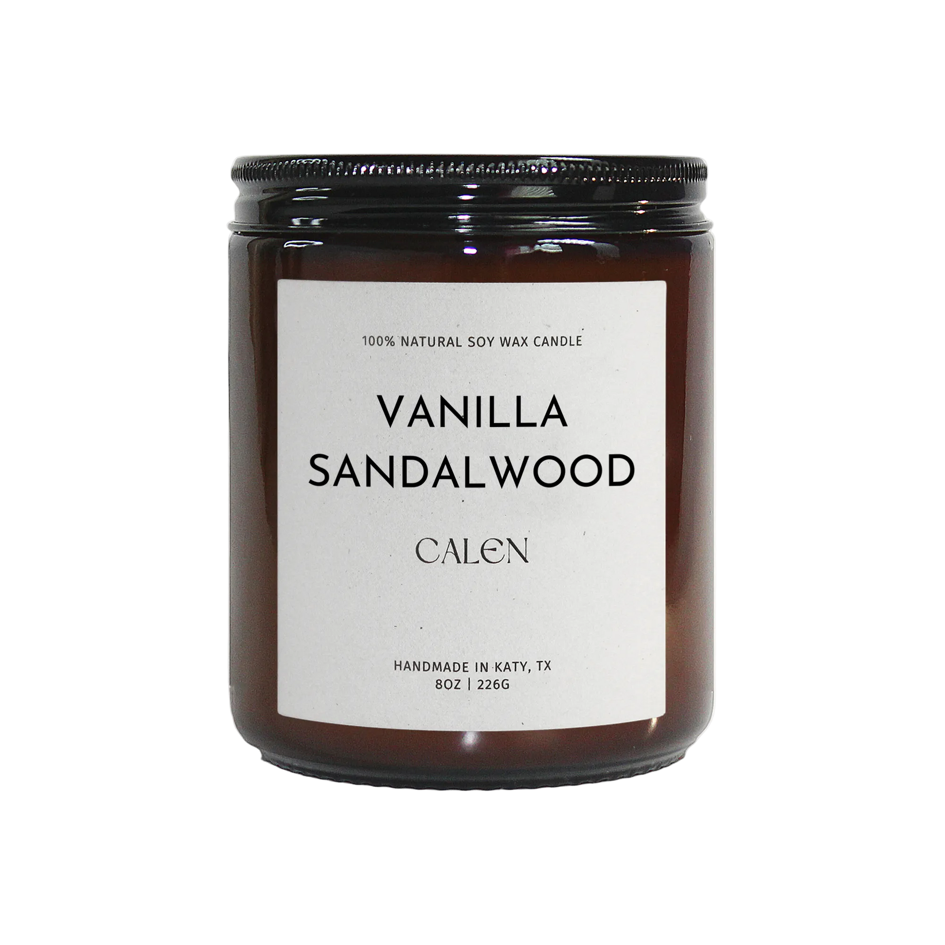 Vanilla sandalwood candle with a black lid on a white background