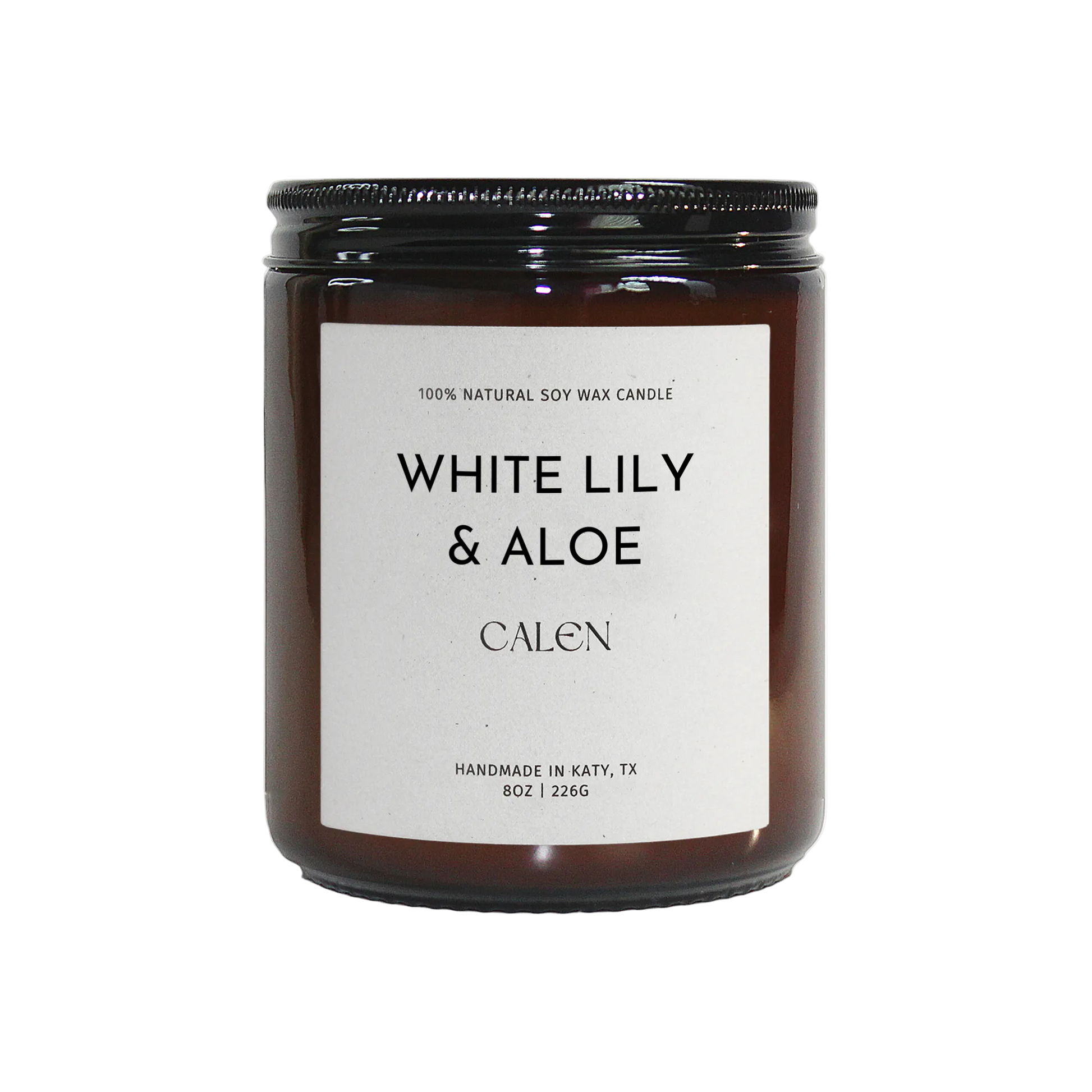Candle with 'White Lily & Aloe' label on a white background