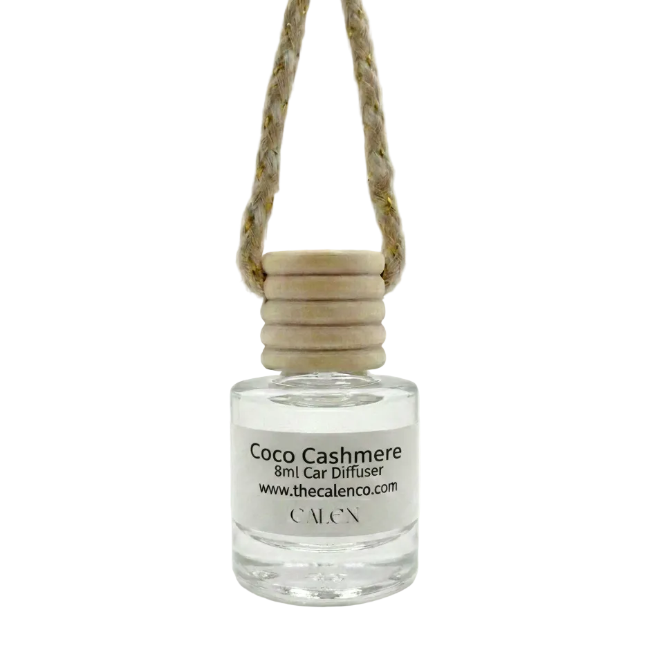 Coco Cashmere car diffuser bottle with wooden cap on a white background